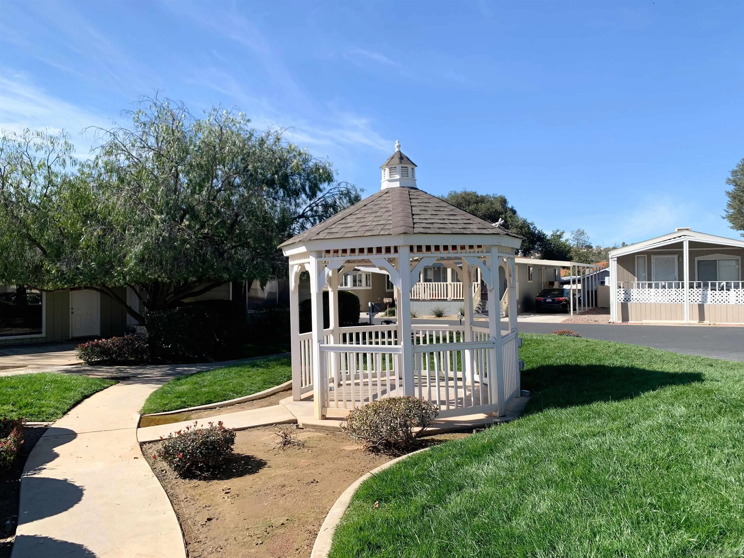 3505 Alpine Boulevard, Unit 57 Alpine, CA 91901 - Photo 23 of 28 This community offers a grass area, clubhouse and pool.