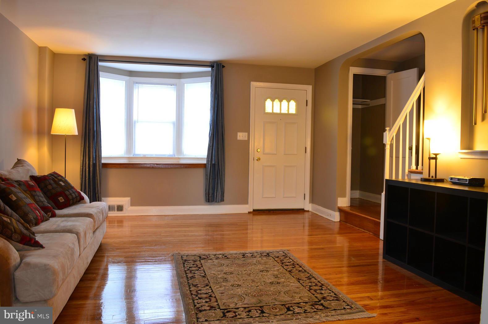 5019 West Hills Road Baltimore, MD 21229 - Photo 2 of 30 a living room with furniture and a window
