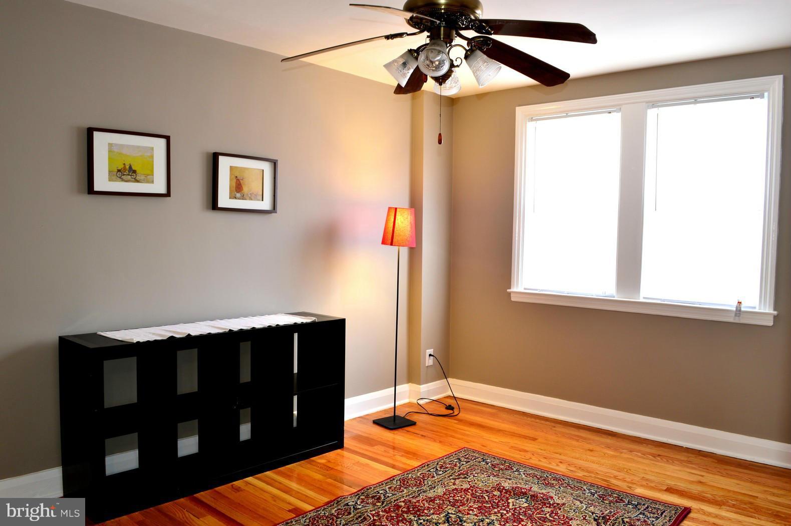 5019 West Hills Road Baltimore, MD 21229 - Photo 24 of 30 a bedroom with a bed and a window