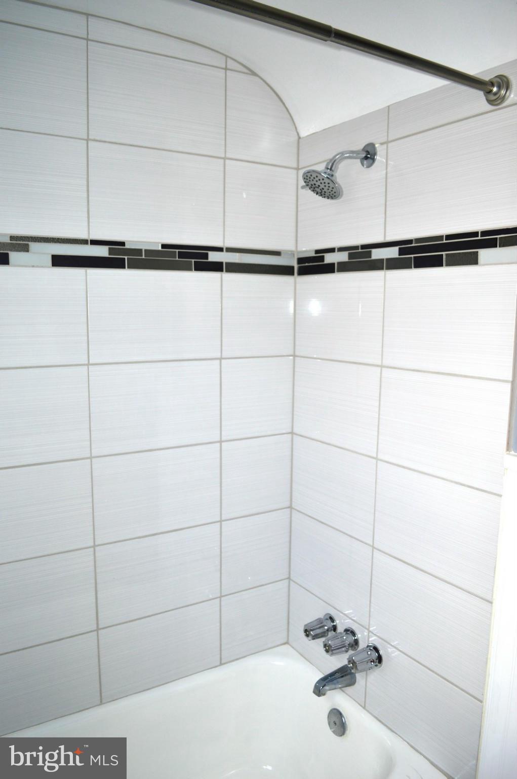 5019 West Hills Road Baltimore, MD 21229 - Photo 27 of 30 a bathroom with a shower