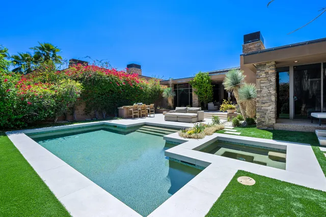a view of a swimming pool with a patio