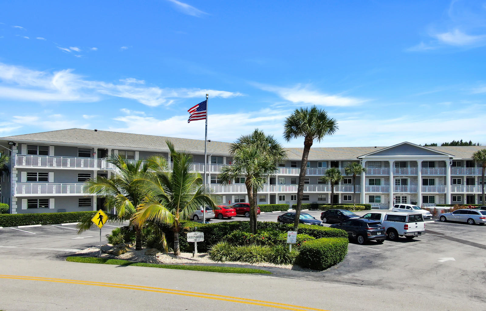 a view of a patio with couches and table potted plants