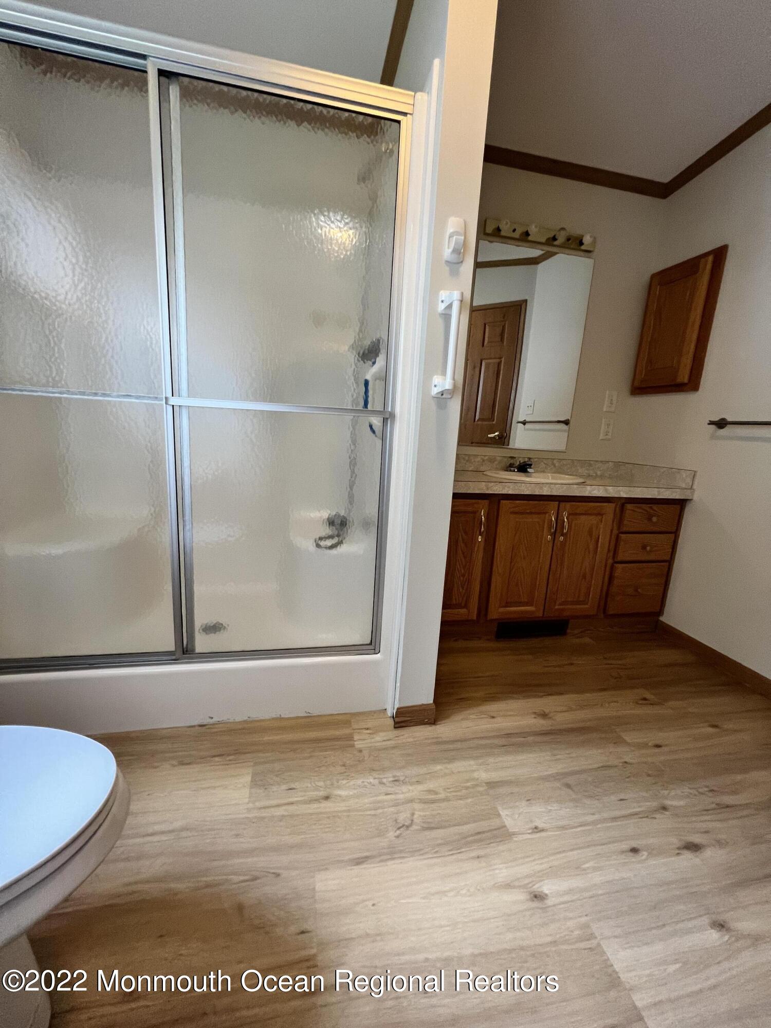123 Woody Road Freehold, NJ 07728 - Photo 12 of 19 a bathroom with a tub