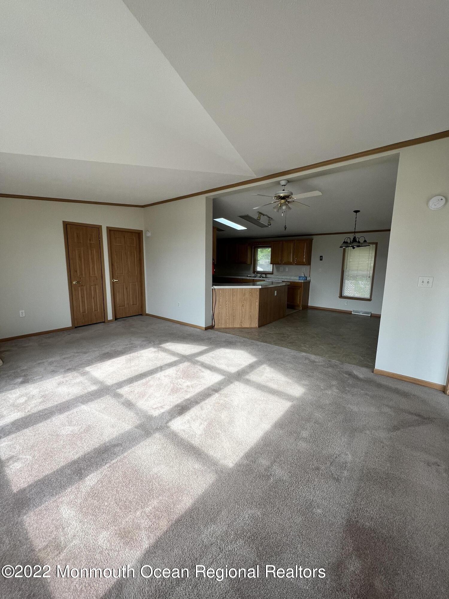 123 Woody Road Freehold, NJ 07728 - Photo 5 of 19 a view of a big room with closet and windows