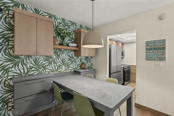 a kitchen with a table and chairs