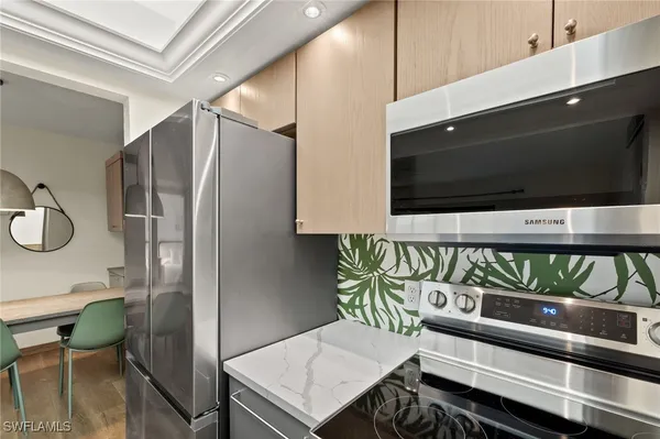 a hallway with chairs and a flat screen tv