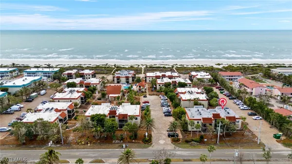 a sign that is sitting in front of flowers