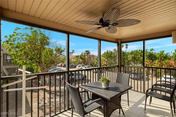 a view of a balcony with furniture
