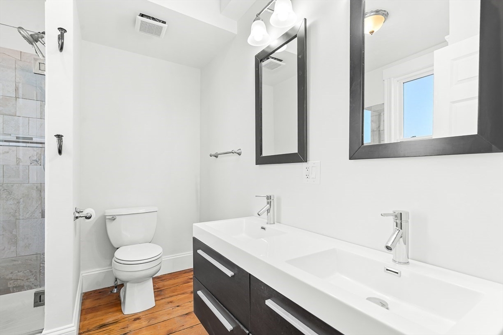 11 Symonds Street, Unit 2 Salem, MA 01970 - Photo 23 of 30 a bathroom with a sink a toilet and a mirror