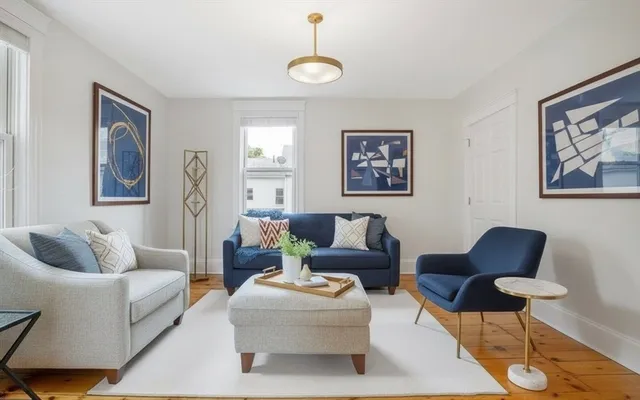 a living room with furniture and a rug