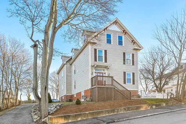 a kitchen with stainless steel appliances a stove a sink cabinets and a dining table