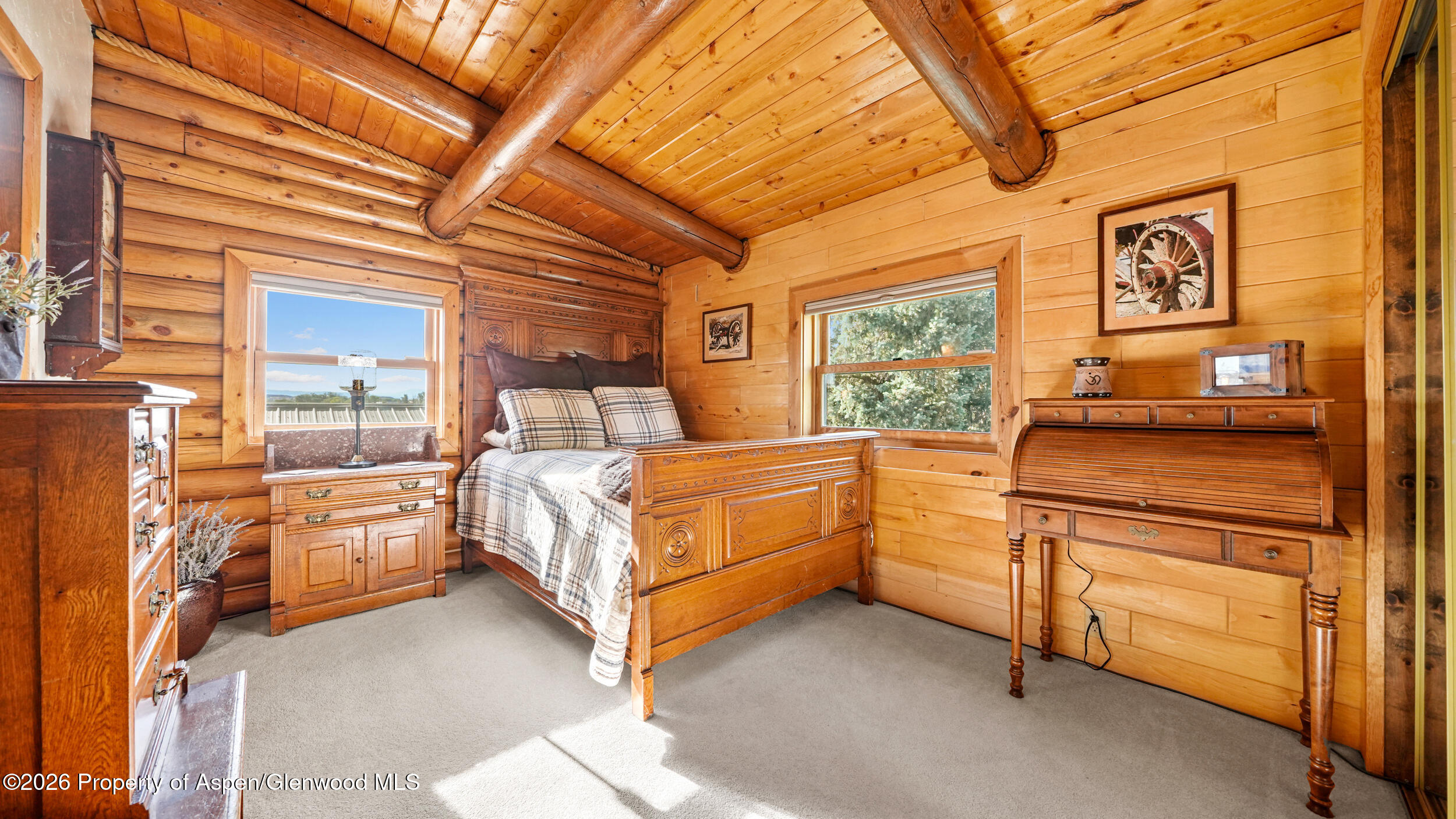 1355 N Road Loma, CO 81524 - Photo 33 of 51 a bedroom with a bed and a dresser