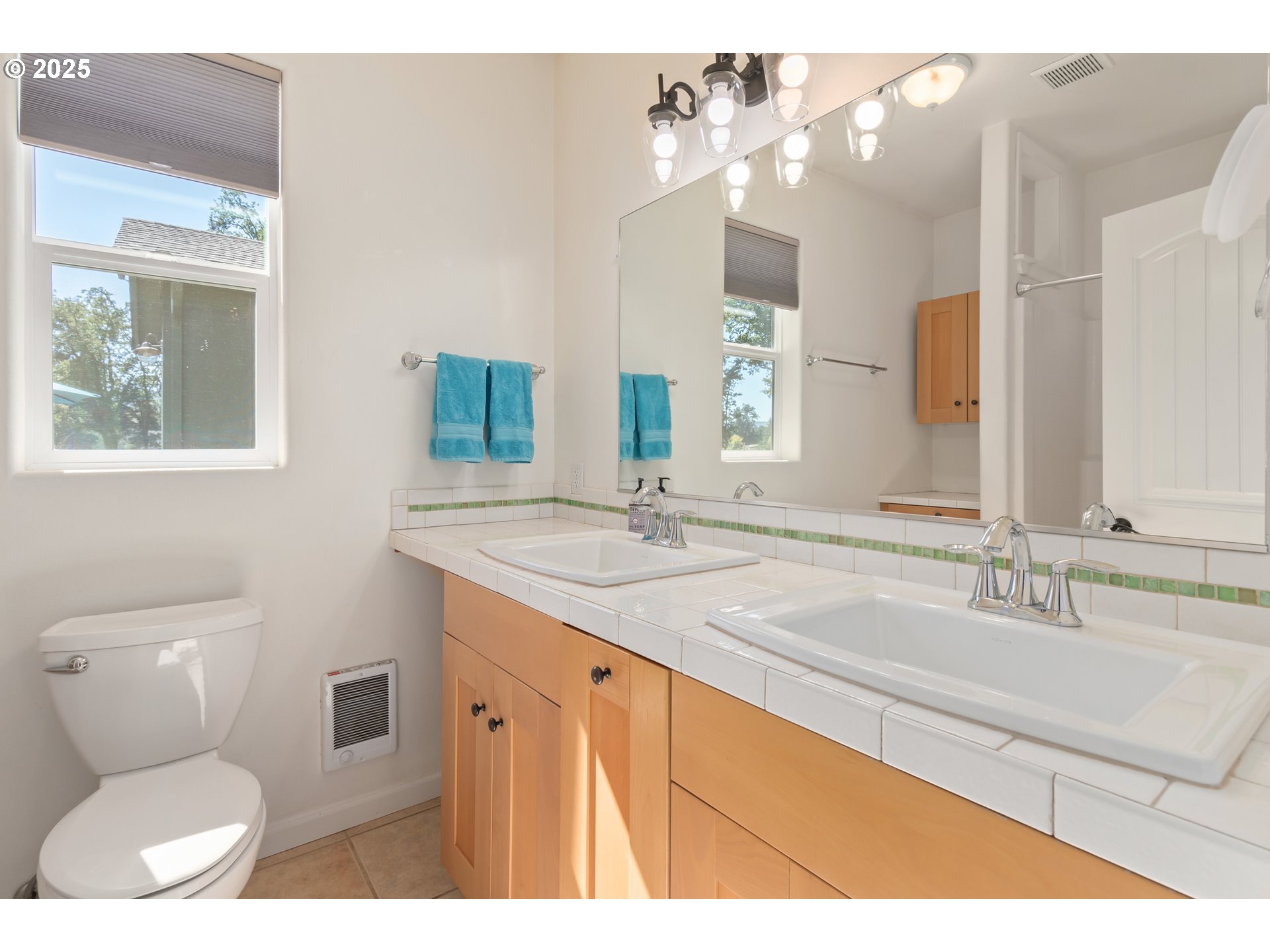78691 Sears Road Cottage Grove, OR 97424 - Photo 20 of 48 a bathroom with a granite countertop toilet sink and mirror