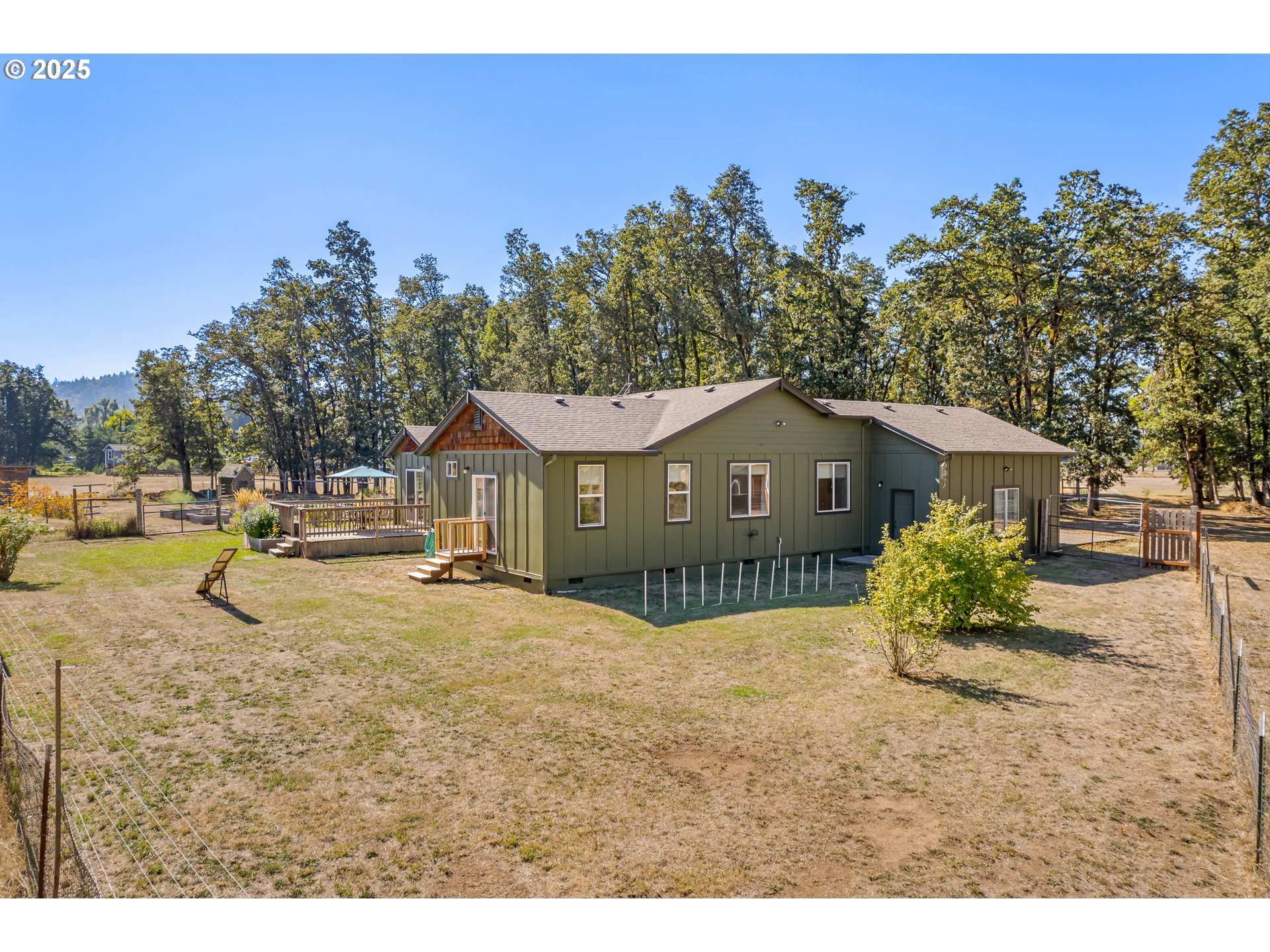 78691 Sears Road Cottage Grove, OR 97424 - Photo 43 of 48 a front view of a house with a yard