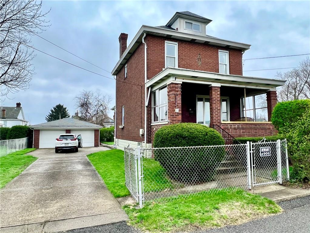 2 Juvet Street McKees Rocks, PA 15136 - Photo 1 of 25 a front view of a house with garden