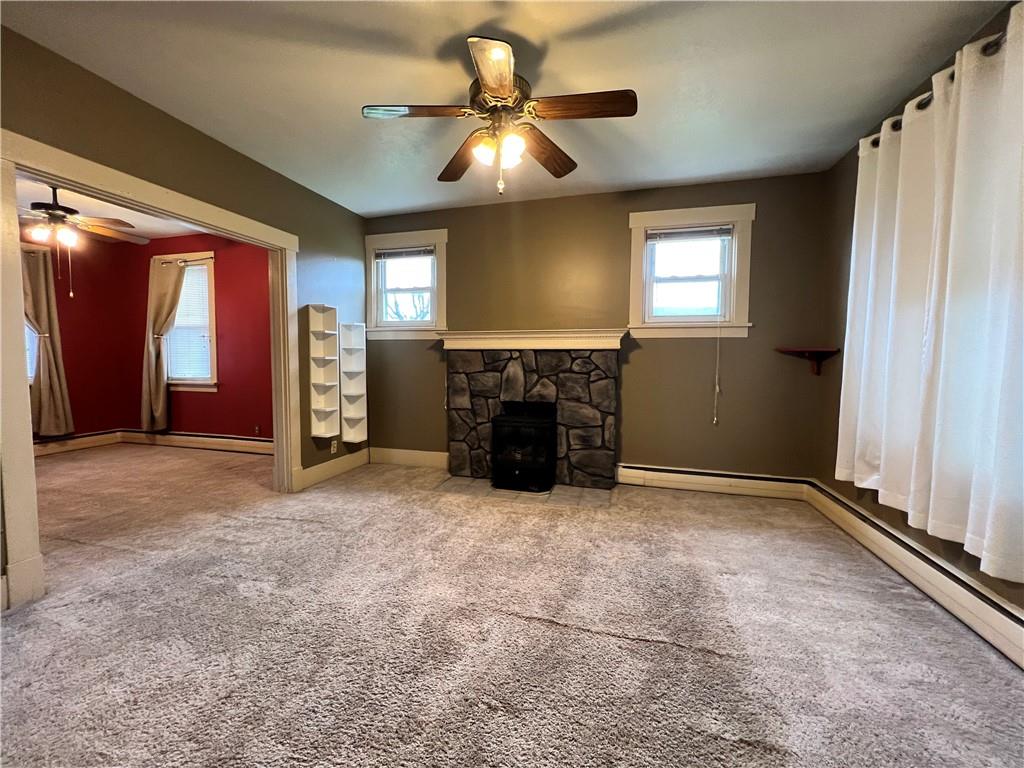 2 Juvet Street McKees Rocks, PA 15136 - Photo 4 of 25 an empty room with windows and fireplace