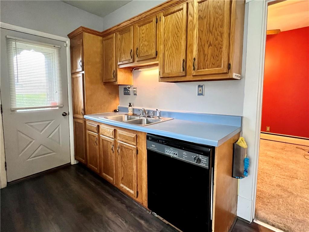 2 Juvet Street McKees Rocks, PA 15136 - Photo 8 of 25 a kitchen with stainless steel appliances granite countertop a sink a stove cabinets and wooden floor