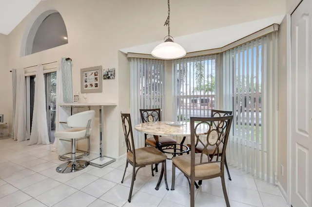 a kitchen with white cabinets sink and stainless steel appliances