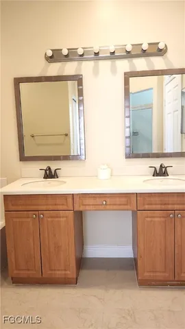 a bathroom with a sink vanity and a mirror