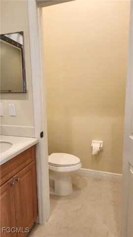 a bathroom with a toilet and a sink