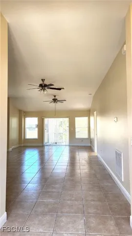 a view of a hallway with a window