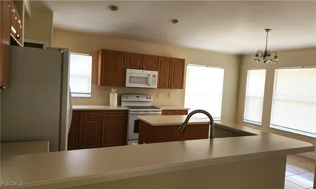 a bathroom with a sink a bathtub and a window