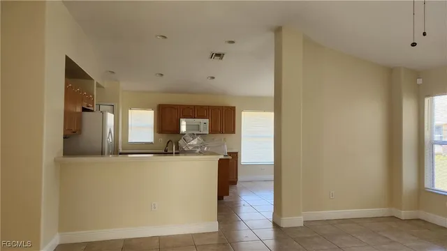 a view of a kitchen with a sink