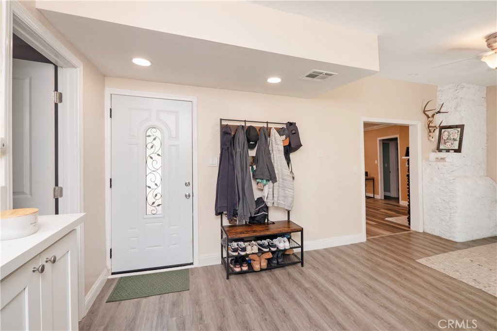 18839 Deer Trail Road Banning, CA 92220 - Photo 13 of 47 a bedroom with a bed and a mirror