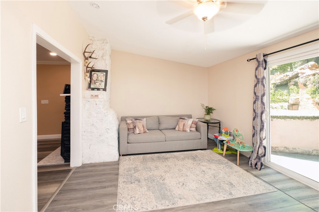 18839 Deer Trail Road Banning, CA 92220 - Photo 14 of 47 a living room with furniture and a rug