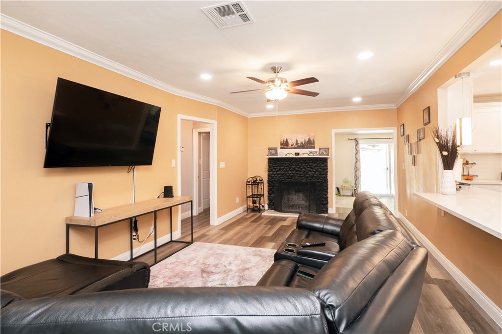 18839 Deer Trail Road Banning, CA 92220 - Photo 15 of 47 a living room with furniture and a flat screen tv