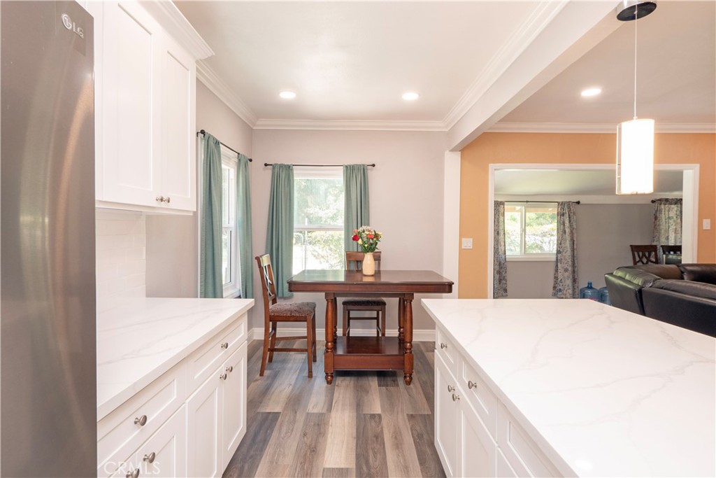 18839 Deer Trail Road Banning, CA 92220 - Photo 21 of 47 a large kitchen with sink a counter space and appliances
