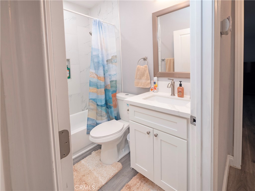 18839 Deer Trail Road Banning, CA 92220 - Photo 24 of 47 a bathroom with a sink toilet vanity and shower