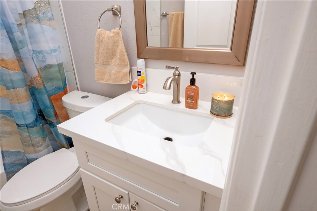 18839 Deer Trail Road Banning, CA 92220 - Photo 26 of 47 a bathroom with a sink and a toilet