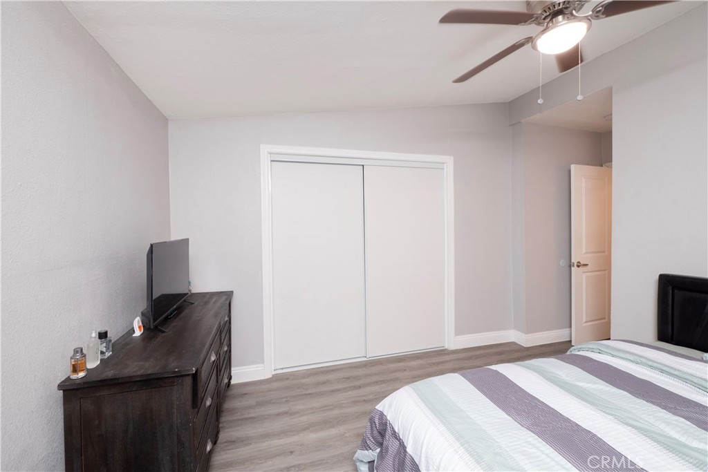 18839 Deer Trail Road Banning, CA 92220 - Photo 28 of 47 a bedroom with a bed and wooden floor