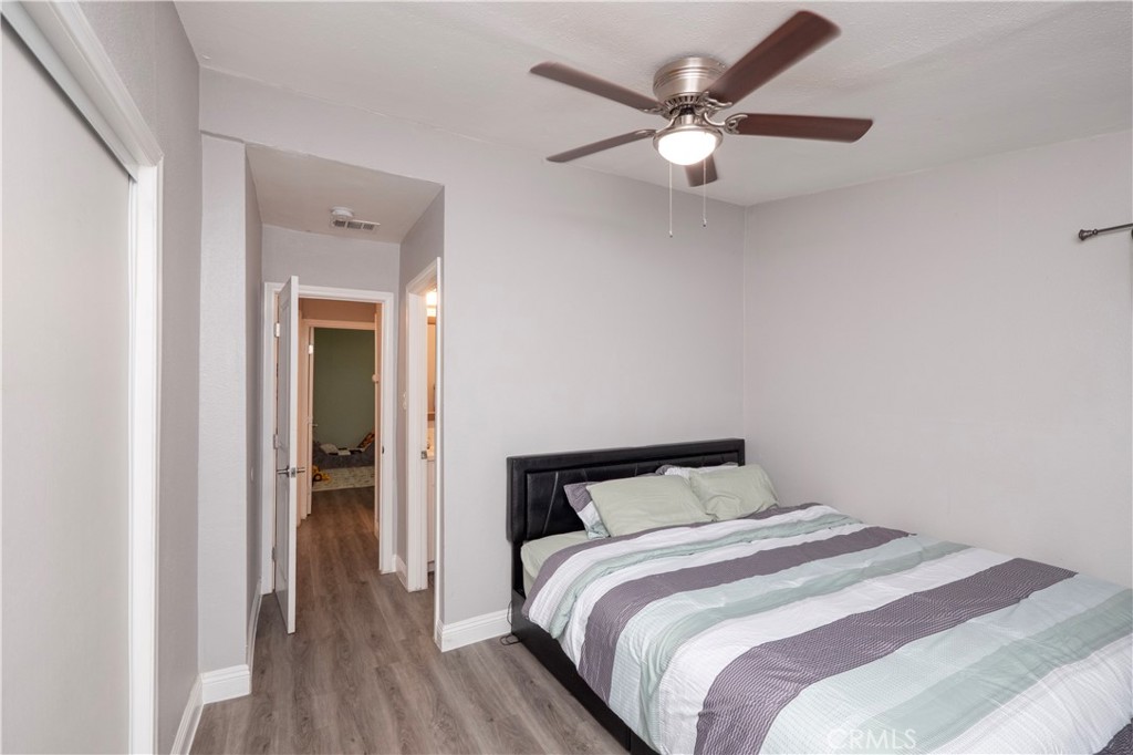 18839 Deer Trail Road Banning, CA 92220 - Photo 29 of 47 a bedroom with a bed and a ceiling fan