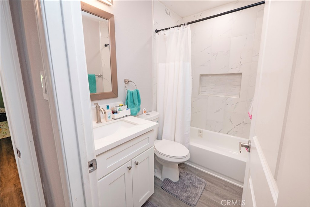 18839 Deer Trail Road Banning, CA 92220 - Photo 30 of 47 a bathroom with a sink toilet and shower