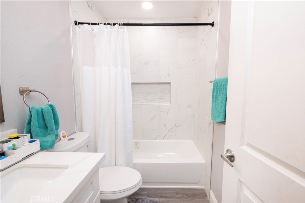 18839 Deer Trail Road Banning, CA 92220 - Photo 31 of 47 a bathroom with a sink toilet and shower