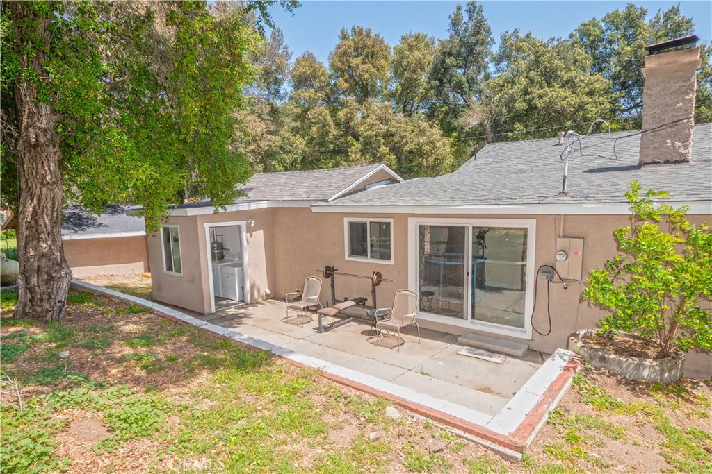 18839 Deer Trail Road Banning, CA 92220 - Photo 36 of 47 a front view of house with yard seating and green space