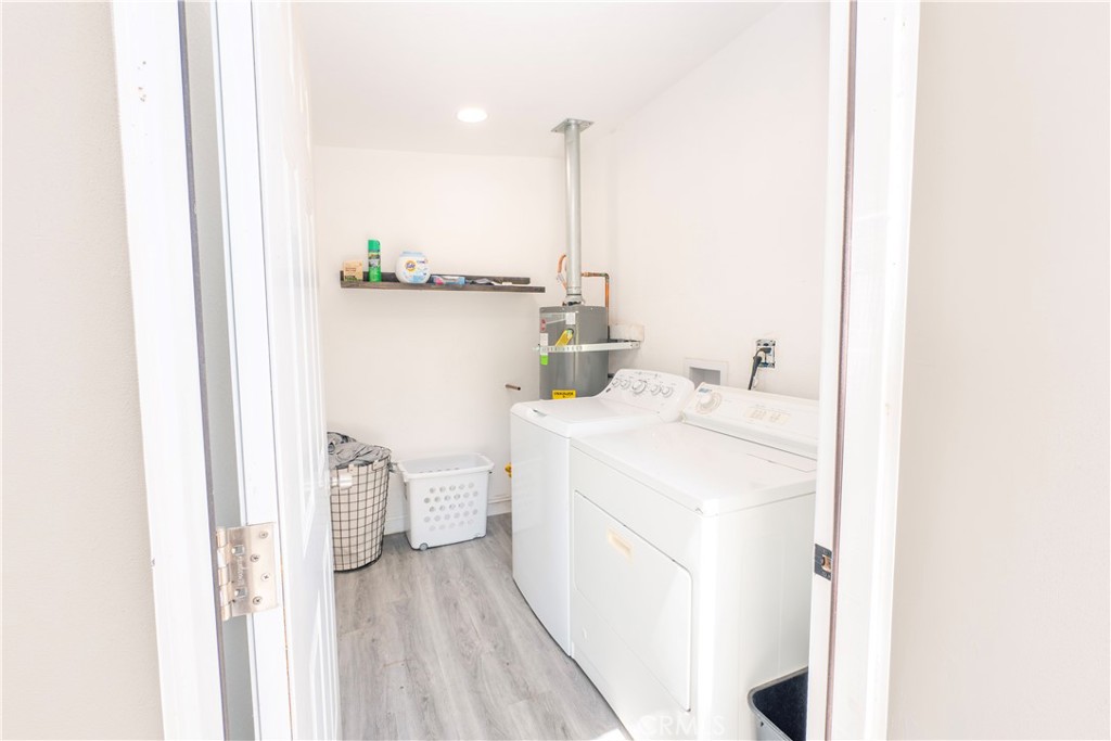 18839 Deer Trail Road Banning, CA 92220 - Photo 38 of 47 a utility room with dryer and washer