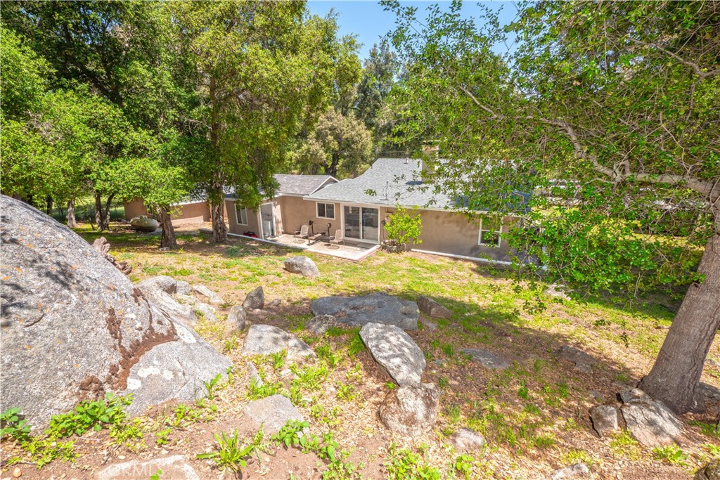 18839 Deer Trail Road Banning, CA 92220 - Photo 40 of 47 a view of a house with pool and sitting area