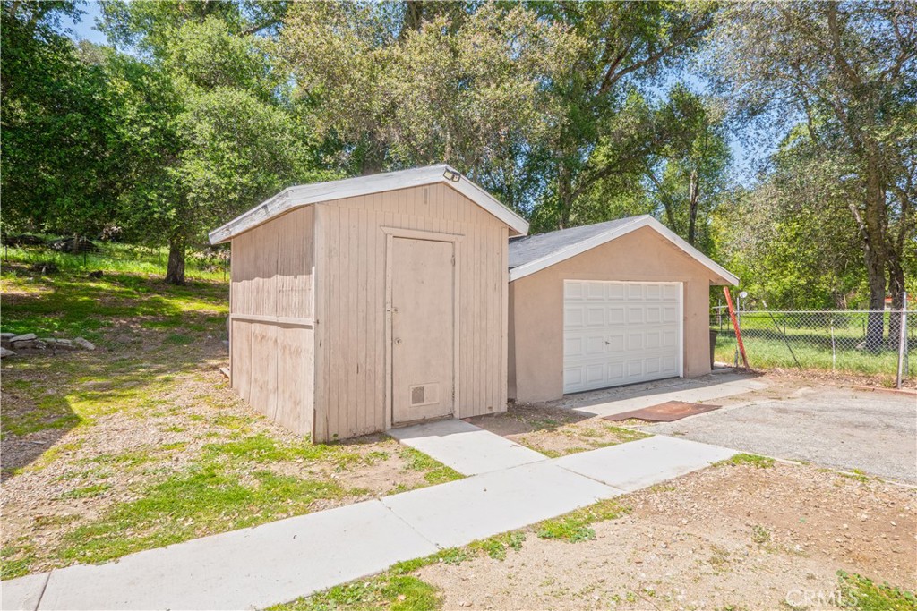 18839 Deer Trail Road Banning, CA 92220 - Photo 42 of 47 a view of backyard of house with wooden fence