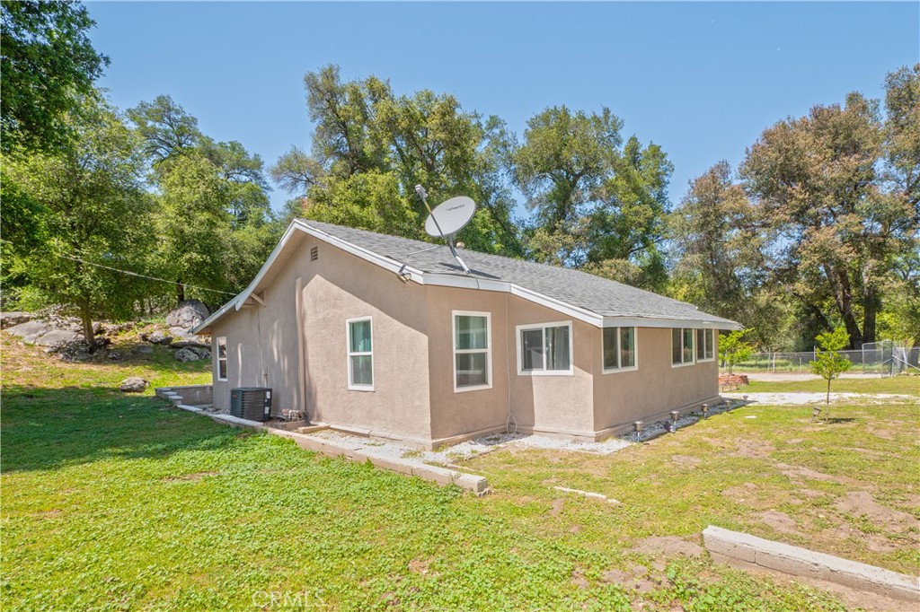 18839 Deer Trail Road Banning, CA 92220 - Photo 43 of 47 a view of a house with a yard