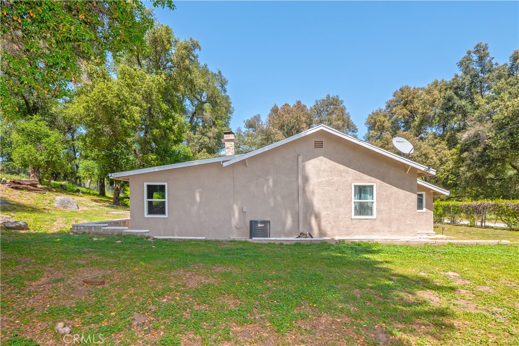 18839 Deer Trail Road Banning, CA 92220 - Photo 44 of 47 a view of a backyard with plants and large tree