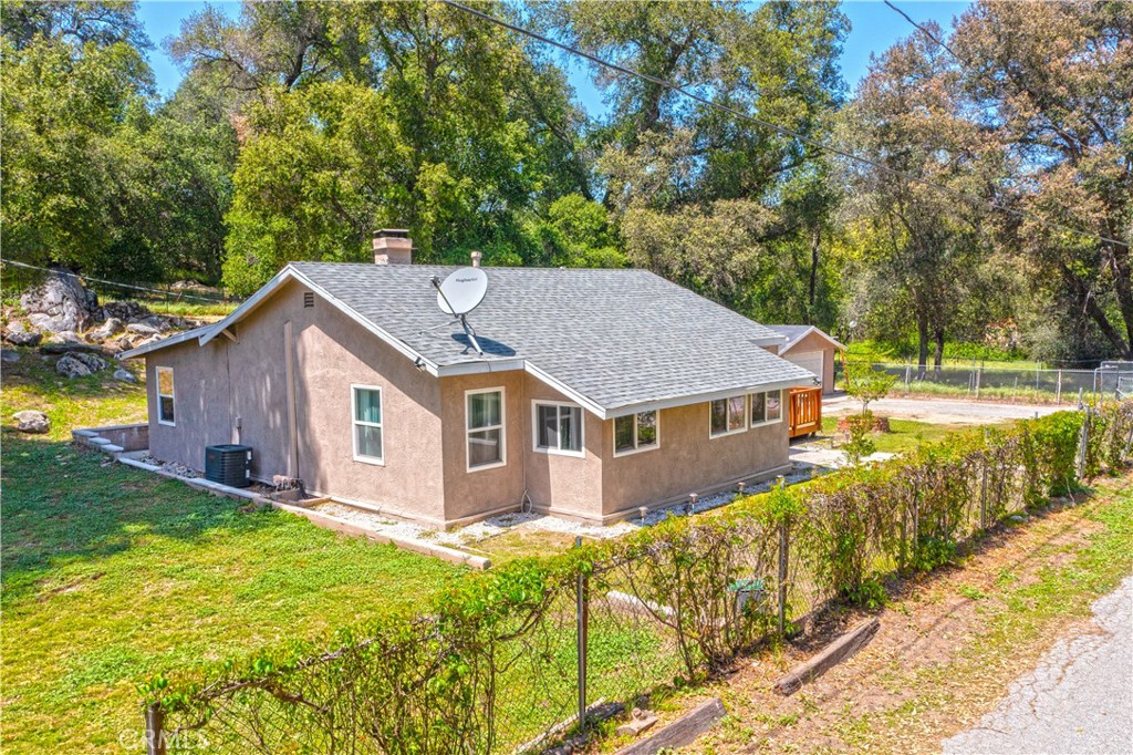 18839 Deer Trail Road Banning, CA 92220 - Photo 45 of 47 a aerial view of a house with a yard table and chairs