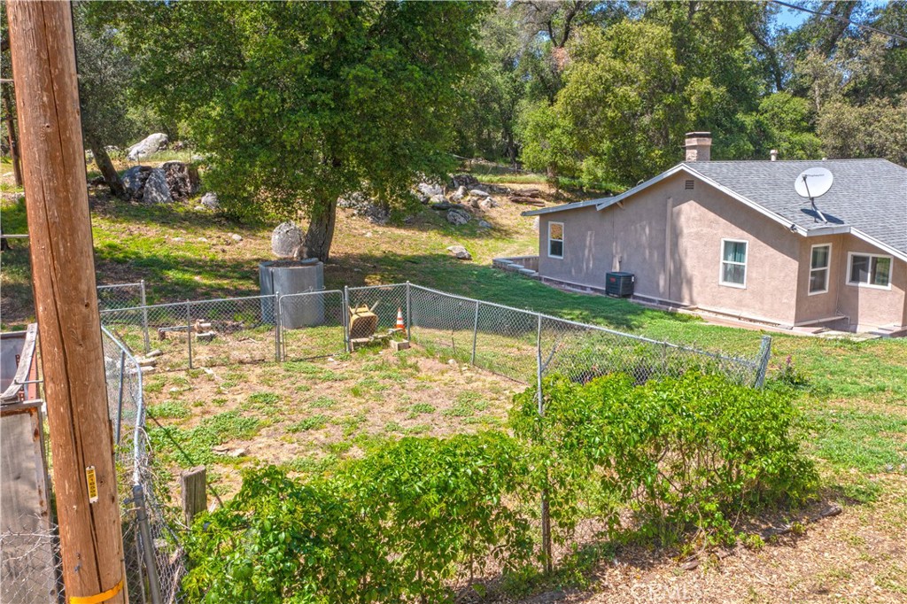 18839 Deer Trail Road Banning, CA 92220 - Photo 46 of 47 a front view of a house with garden