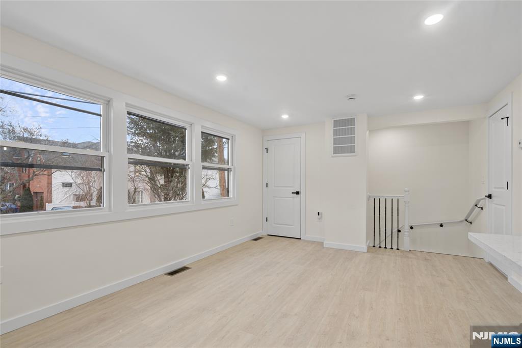 369 Hops Lane Secaucus, NJ 07094 - Photo 8 of 17 a view of an empty room with a window