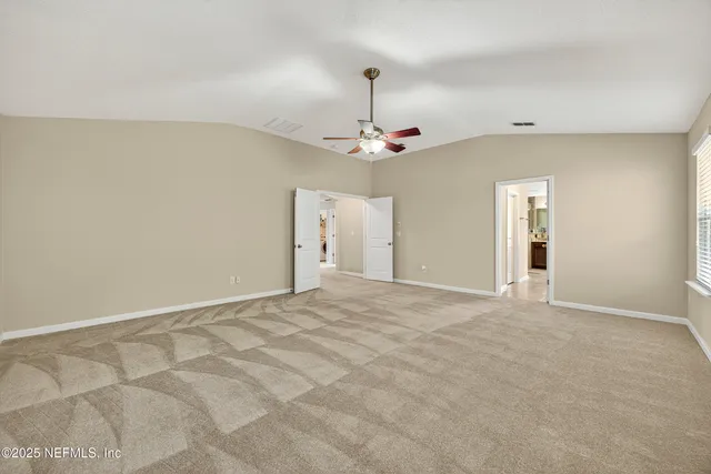 a large spacious bathroom with a large tub sink and mirror