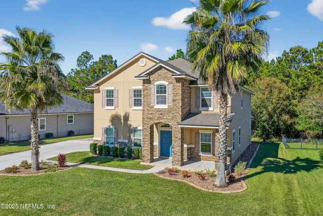 a front view of a house with a yard table and chairs