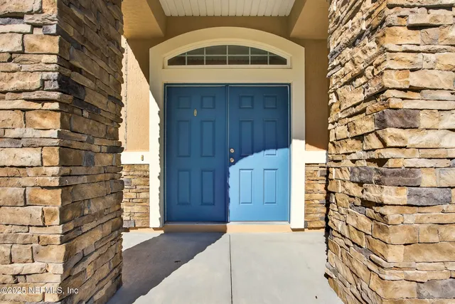 a view of entryway with a front door