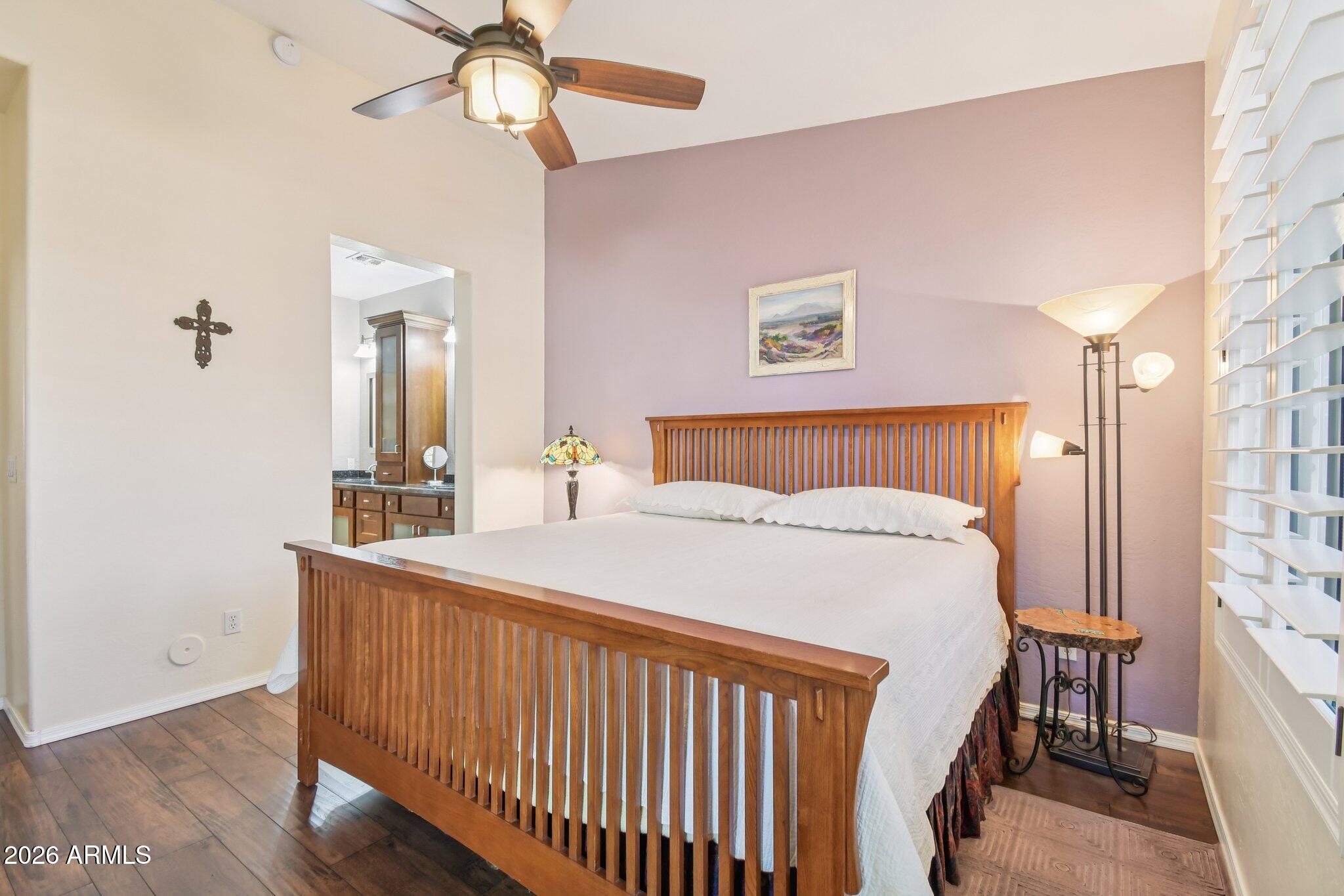 1024 East Frye Road, Unit 1039 Phoenix, AZ 85048 - Photo 12 of 32 a bedroom with a bed and a chandelier